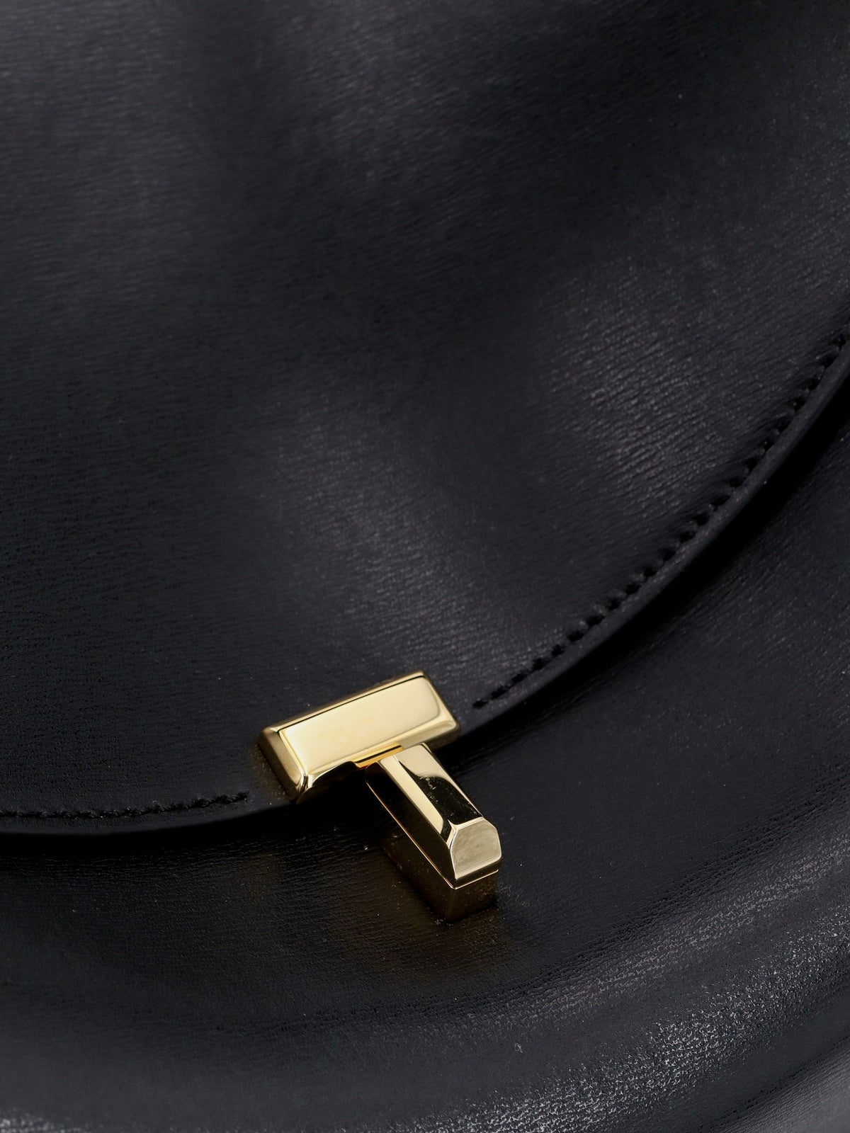 Toteme T-Lock leather crossbody bag - Black
