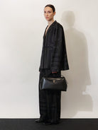 Toteme T-Lock leather crossbody bag - Black