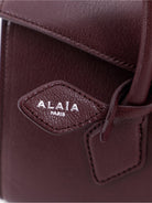 Alaïa Le Teckel Flap leather handbag - Rougegrenat