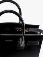 Saint Laurent Baby Sac de Jour leather handbag with padlock - Nero/Nero