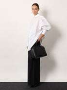 Toteme Leather handbag with engraved logo on the front - Black