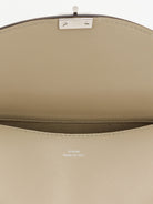 Toteme T-Lock hammered leather crossbody bag - Fawn
