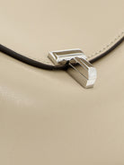 Toteme T-Lock hammered leather crossbody bag - Fawn