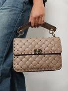 Valentino Garavani Rockstud Spike leather crossbody bag with iconic all-over studs - Poudre