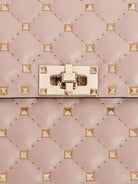 Valentino Garavani Rockstud Spike leather crossbody bag with iconic all-over studs - Poudre