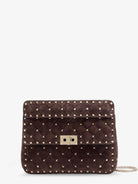 Valentino Garavani Rockstud Spike suede crossbody bag with iconic all-over studs - Ebonybrown