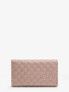 Valentino Garavani Rockstud Spike leather crossbody with iconic all-over studs - Poudre