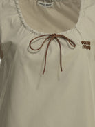 Miu Miu Short a-line dress with logo - Beige